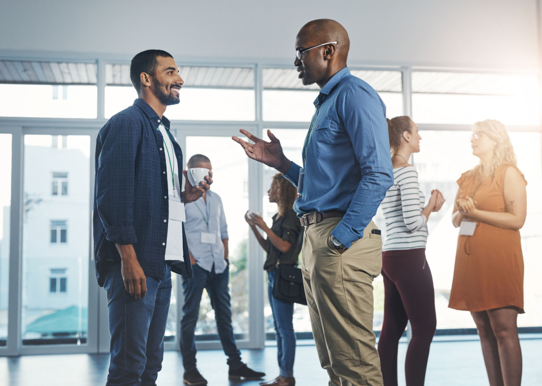 Group of people chatting at a networking event.