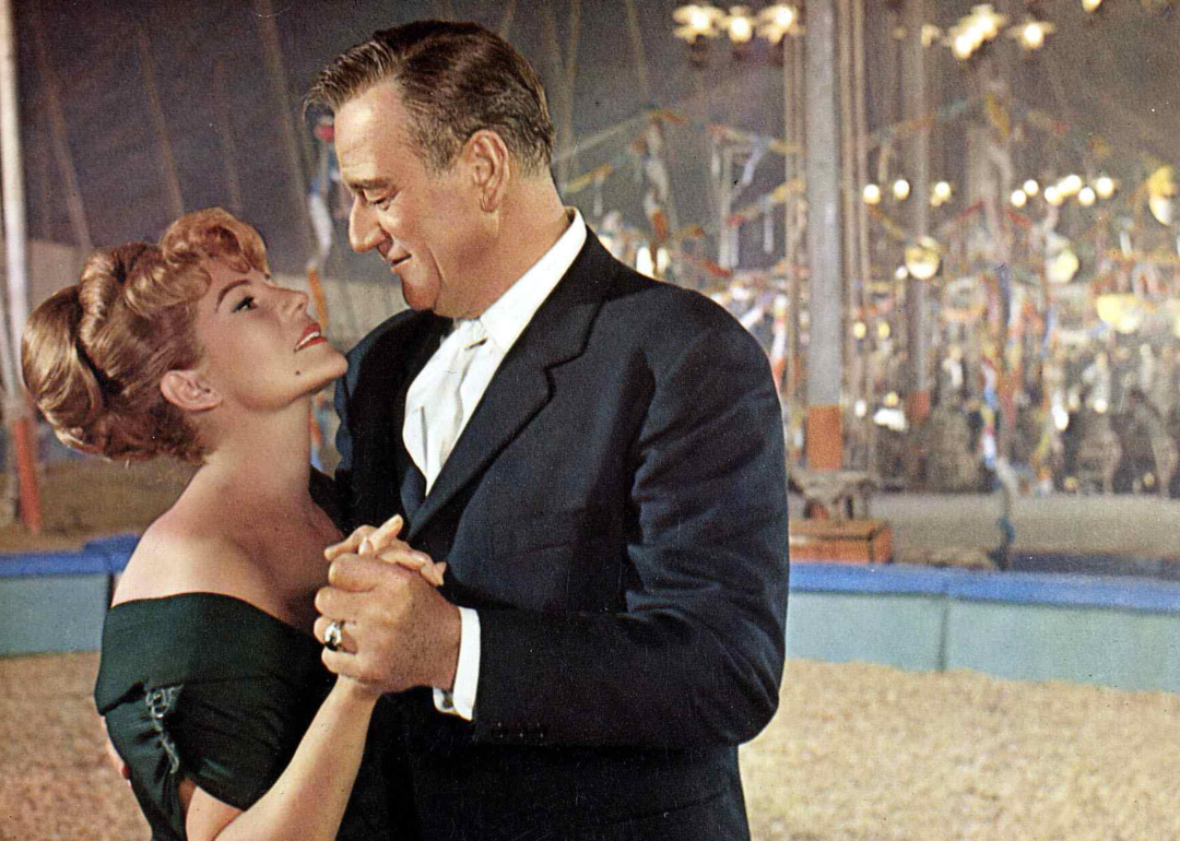 Rita Hayworth and John Wayne in a scene from ‘Circus World.'