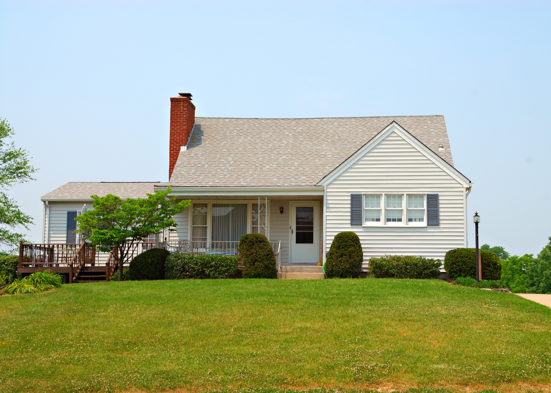 Residential two story wood sided home in a rural neighborhood