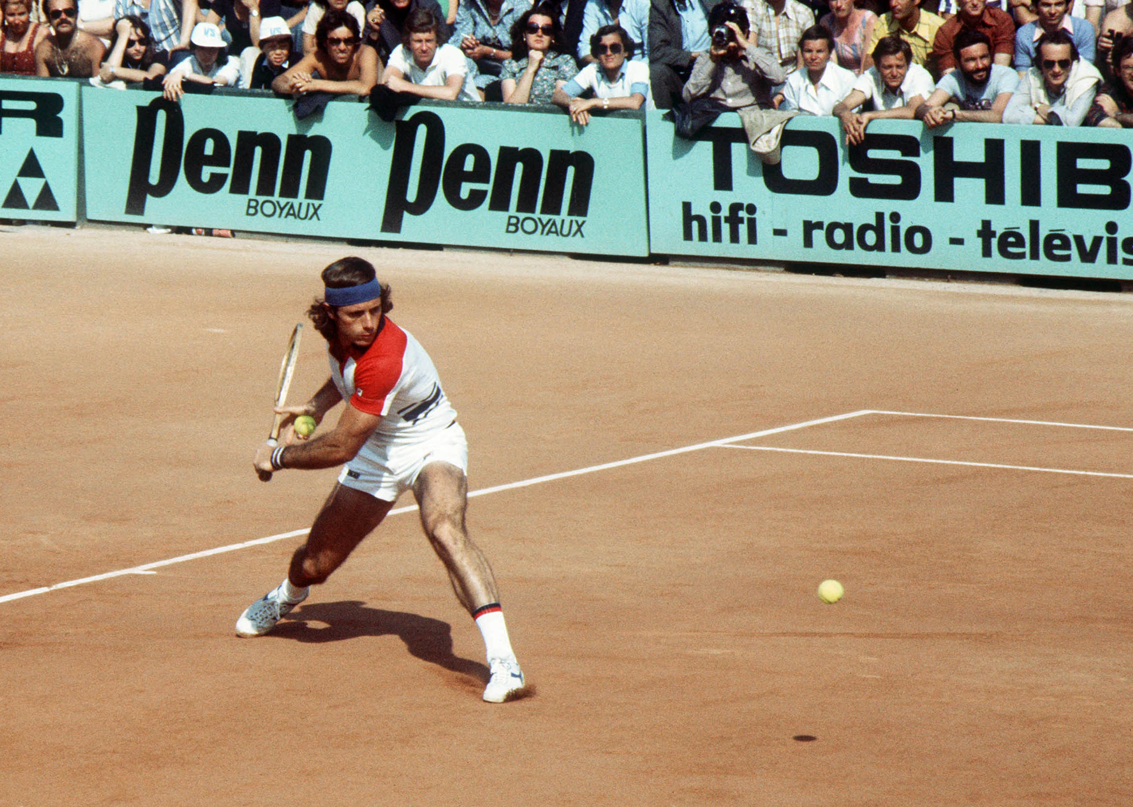 Guillermo Vilas prepares a backhand in his match against Polish player Wojtek Fibak in 1977.