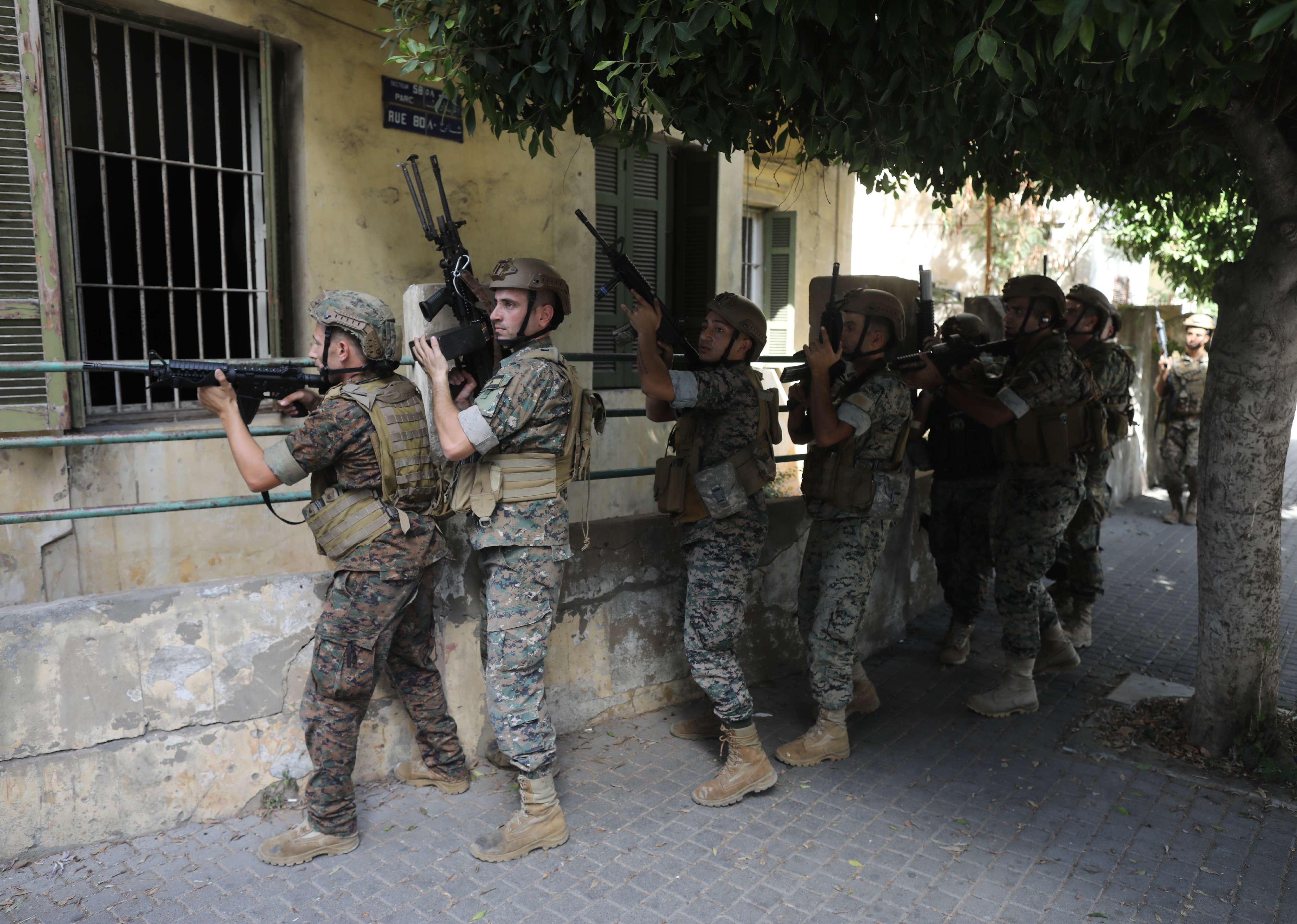 Lebanese national army soldiers take position in a residential neighbourhood.