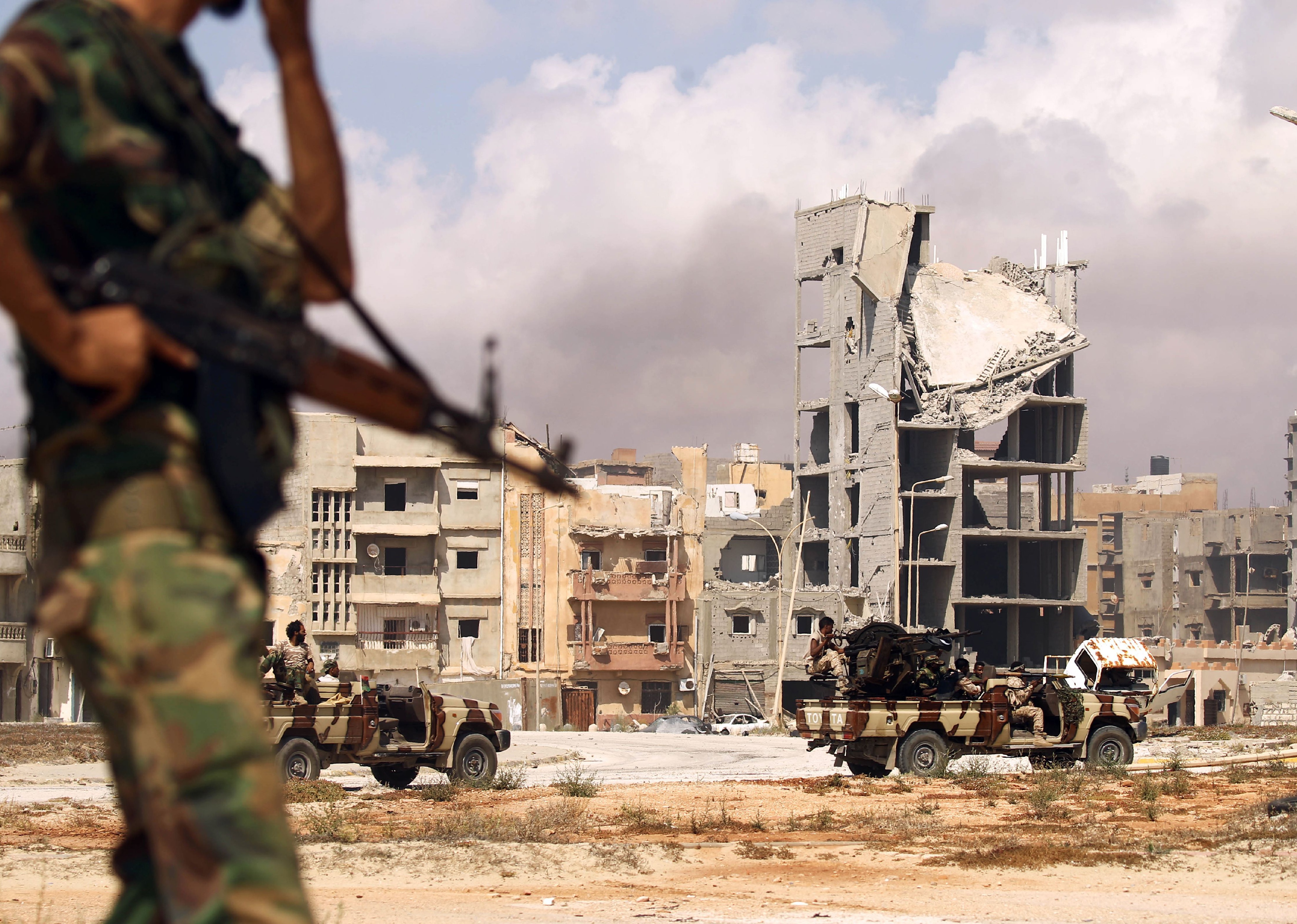 Members of the Libyan National Army patrol a street in central Benghazi