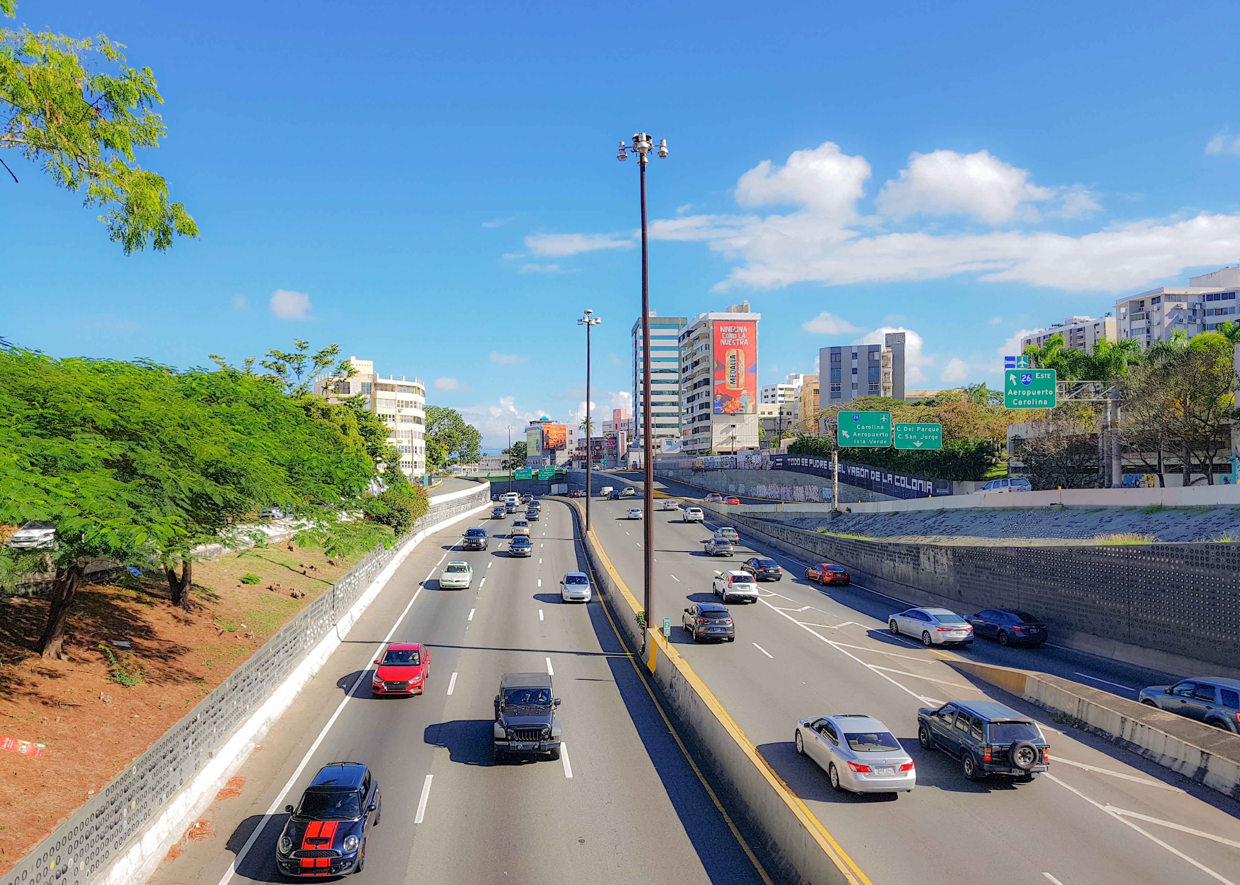 Vehicles drive on the highway in Sanjuan.