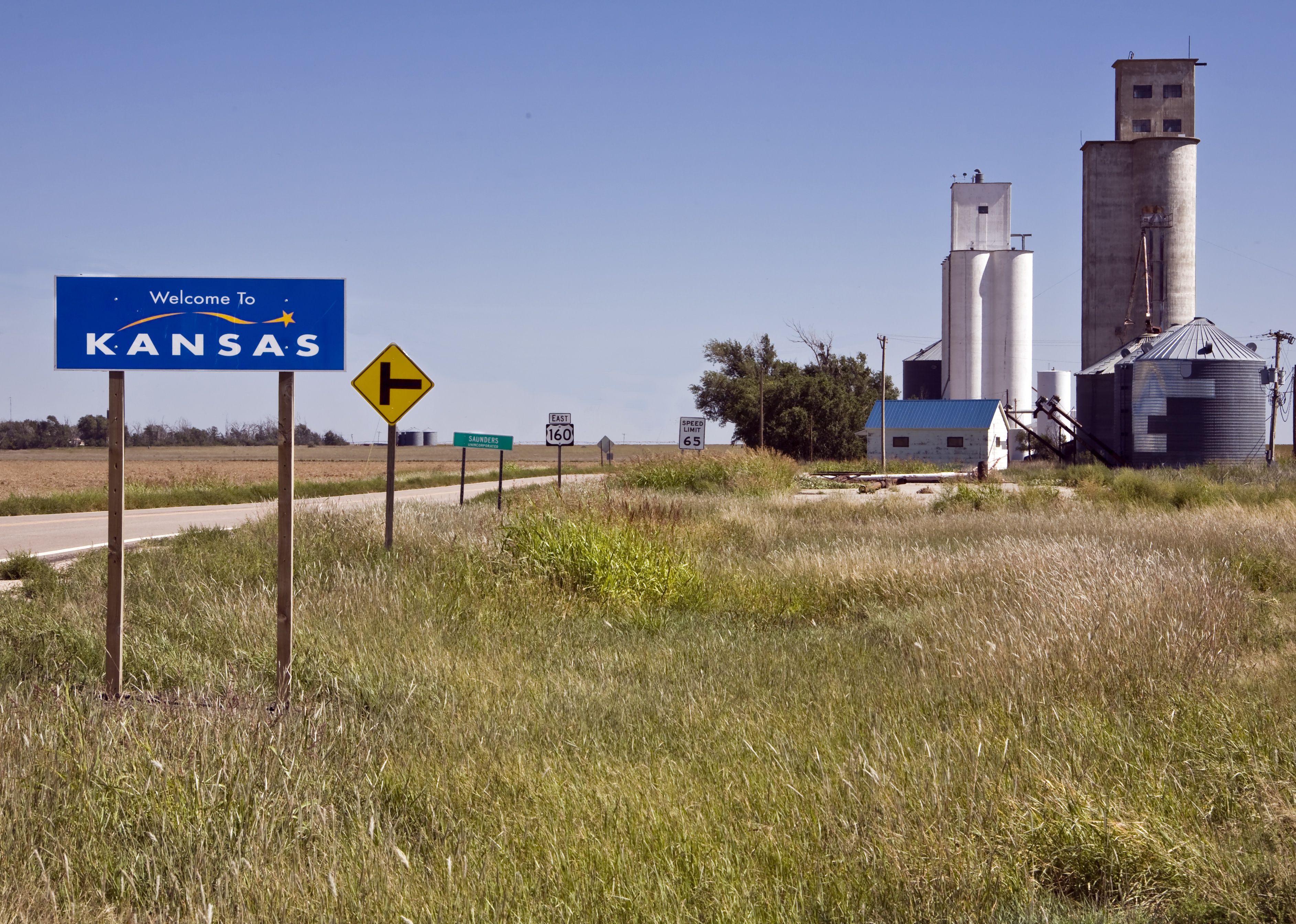Highway at the state line in western Kansas.