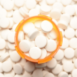 High-angle view of a prescription bottled filled with pills.