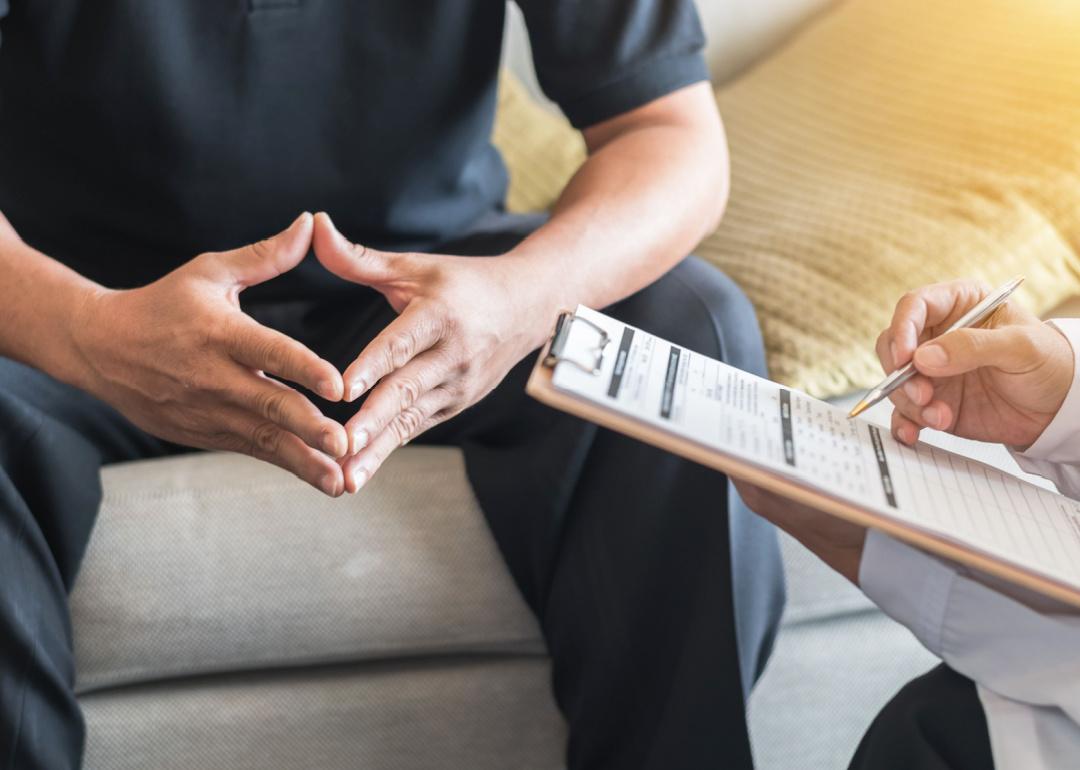 Male patient consulting with doctor.
