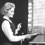 Woman punching time clock