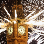 Fireworks coming out of the top of a clock tower. 