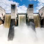 Powerful falls in a concrete hydroelectric dam.