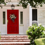 House with red door and American flag.