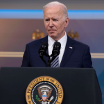 President Biden stands at a podium while discussing the release of oil from Strategic Petroleum Reserve.
