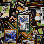 An array of baseball cards spread out on a table