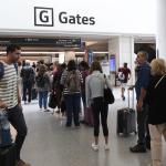 Travelers line up to enter a security checkpoint in the international terminal at San Francisco International Airport on July 01, 2022 in San Francisco, California.