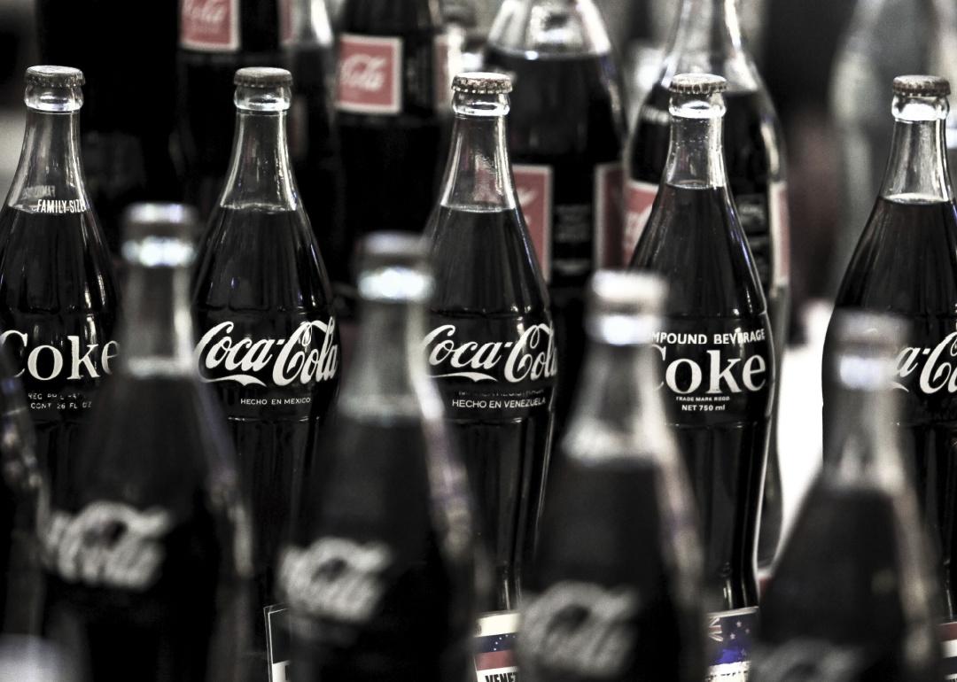 A collection of old and vintage Coca-Cola bottles.