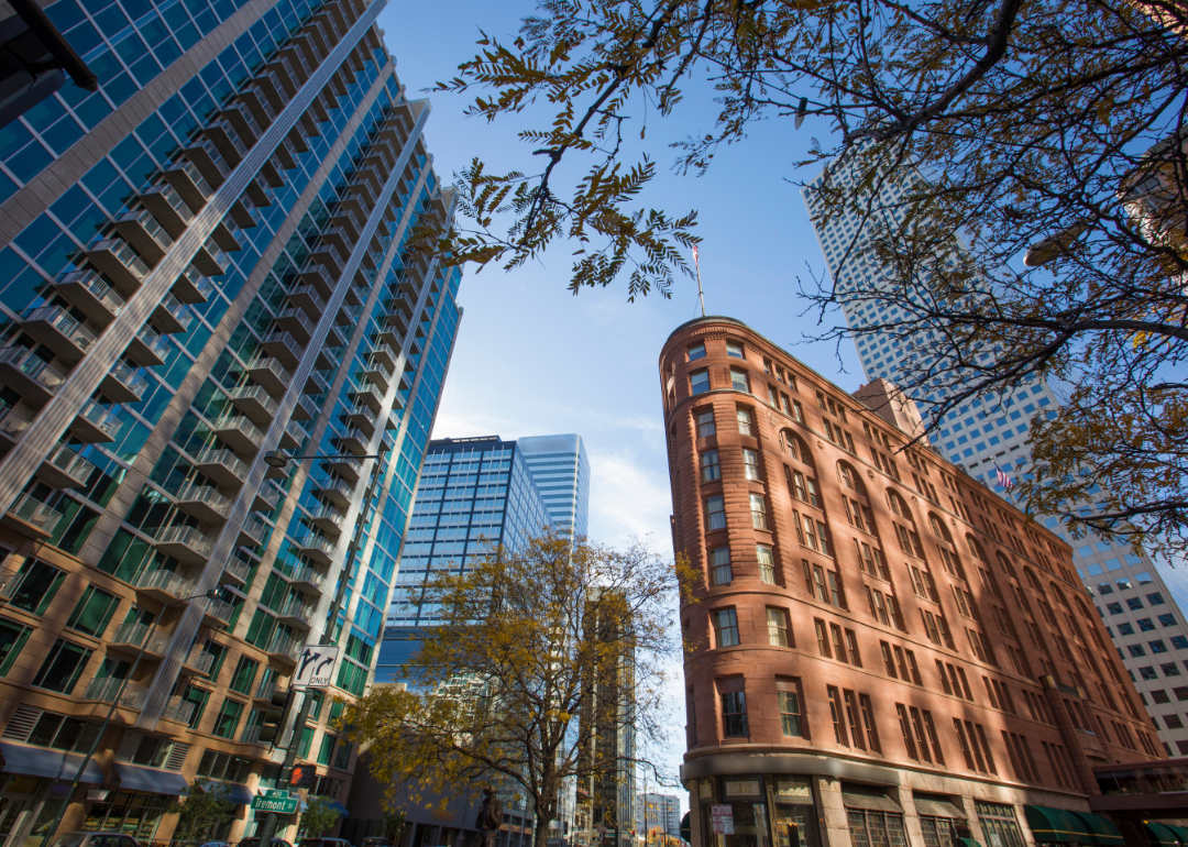 A street-level view of Denver looking up at office buildings