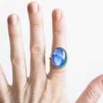 Vintage mood ring on index finger.