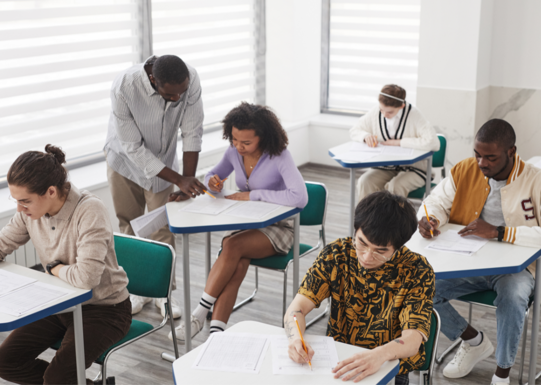 A teacher oversees a classroom of diverse students.