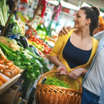 A couple shops at a farmers market
