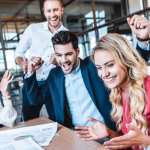 A group of office workers celebrating a success