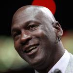 Former player Michael Jordan of the Chicago Bulls addresses the crowd during a 20th anniversary recognition ceremony of the Bulls 1st NBA Championship in 1991 during half-time of a game bewteen the Bulls and the Utah Jazz at the United Center on March 12, 2011 in Chicago, Illinois. 