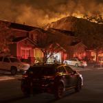 Flames come close to houses during the Blue Ridge Fire on October 27, 2020 in Chino Hills, California.