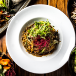 A selection of five vegan dishes on a table.