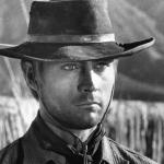 Actor John Phillip Law stands wearing cowboy hat in a scene from the 1967 film 'Death Rides a Horse.'