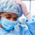 Closeup of an exhausted operating room nurse.