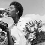 Althea Gibson kisses the cup she was awardedafter winning the French International Tennis Championships in Paris in 1956.