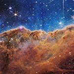 James Webb Space Telescope NIRCam Image of the 'Cosmic cliffs' in Carina Nebula via NASA.