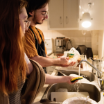 two people doing dishes together