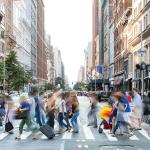 anonymous people walking in New York city street with motion blur, concept of average person