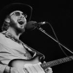Country musician Hank Williams Jr. plays guitar as he performs onstage at an unspecified venue, Oakbrook, Illinois on Nov. 27, 1977. 