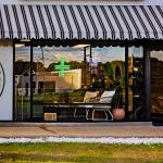 A store called Healthy Harvest CBD is pictured with signage at the front.