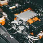View of electric vehicle engine under car hood.