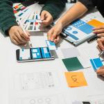 A creative team collaborating on UX product development.