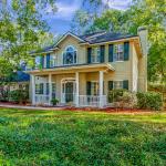 Two story home surrounded by trees in Fleming Island, Florida.