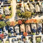Aerial view of median single-family houses in a suburban neighborhood in Dallas, Texas.