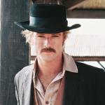 Actor Robert Redford in a black cowboy hat and tan leather waistcoat, in a publicity portrait issued for the 1969 Western film 'Butch Cassidy and the Sundance Kid.'