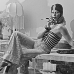 A model wearing wide-legged trousers, a striped tube top and a turban-style hat at the Biba boutique in London, UK, 6th September 1973.