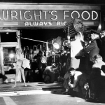 Marilyn Monroe standing over a subway grating with her skirts blown up by a giant blower while talking to Tom Ewell in a scene from the movie "Seven-Year Itch."