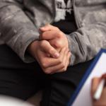 Close up hands of teenager at counseling.