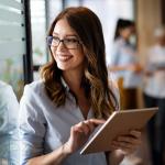 Woman working with tablet in office.