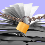 A stack of books stand behing a padlock and chains
