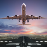 A front view of an airplane taking off