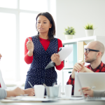 A manager leads a team meeting