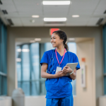 A registered nurse walking down a hallway