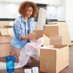 A woman unpacking boxes as she moves house