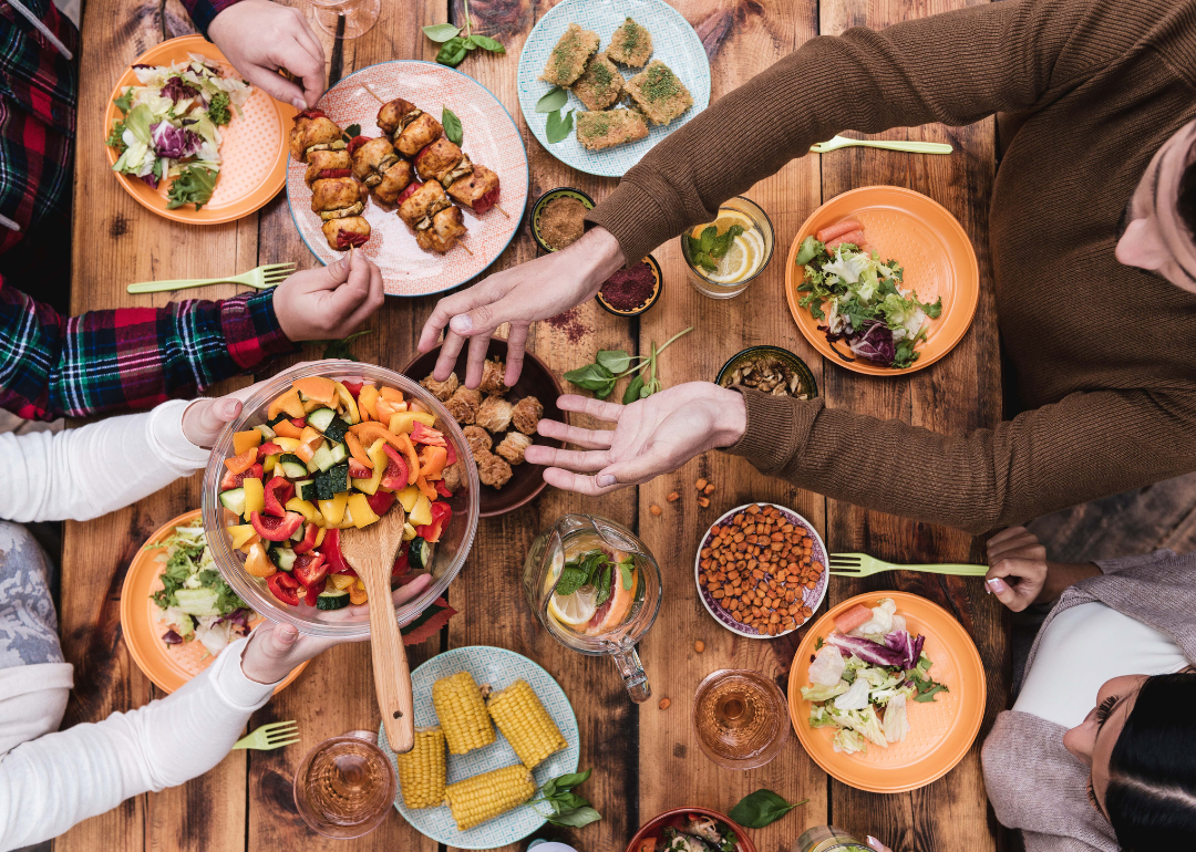 A spread of food on a rustic wooden table.
