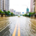 A flooded street leading to downtown.